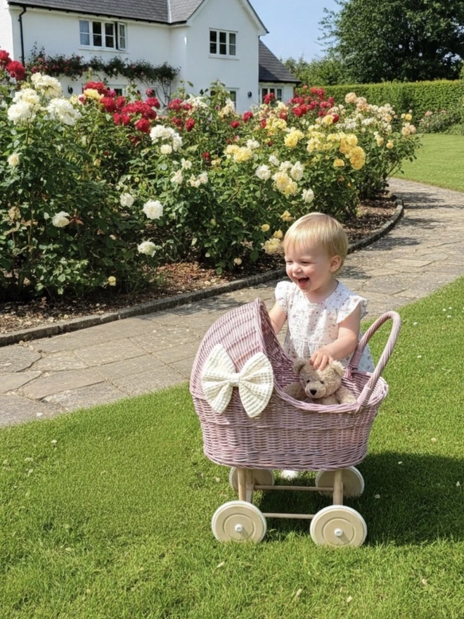 Light pink pram with bow