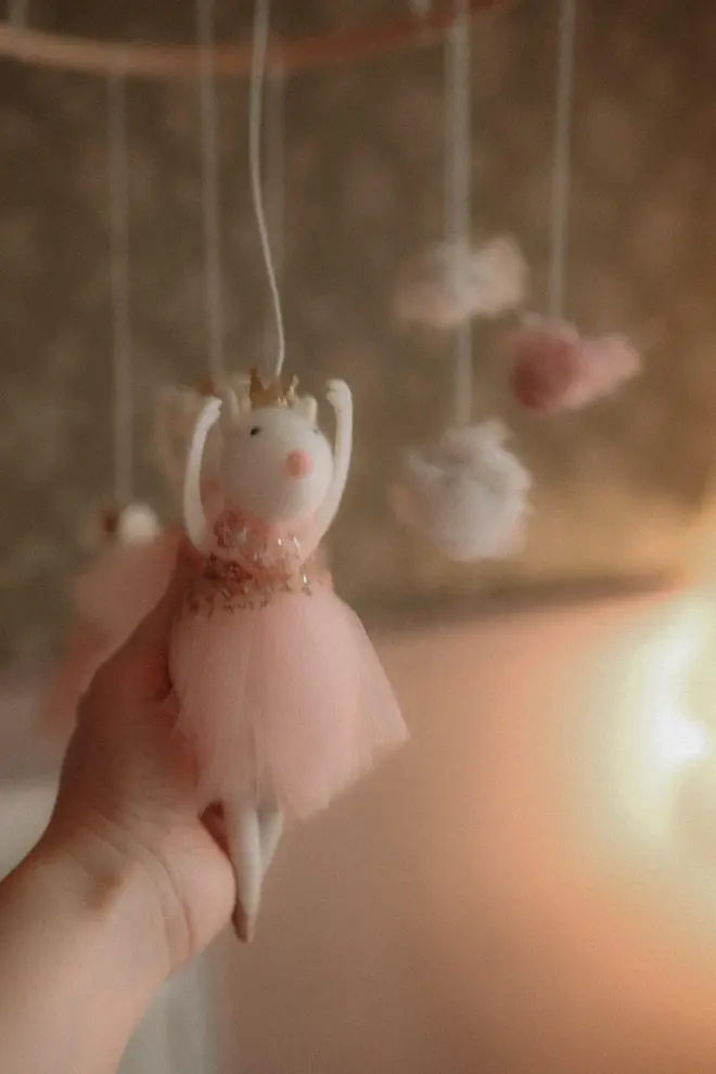 Hanging Mice Ballerina Felt Carousel Decoration, a hanging mice carousel decoration suspended in a child's decorated bedroom. 