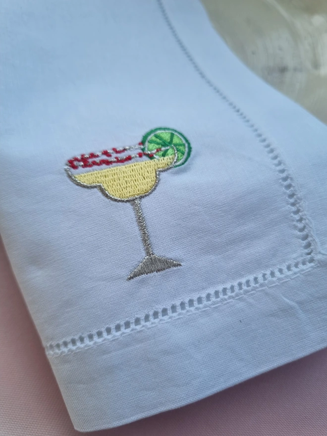 an embroidered margarita cocktail napkin