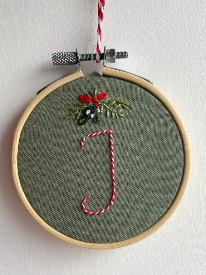 Hand embroidered Christmas decoration with the letter J