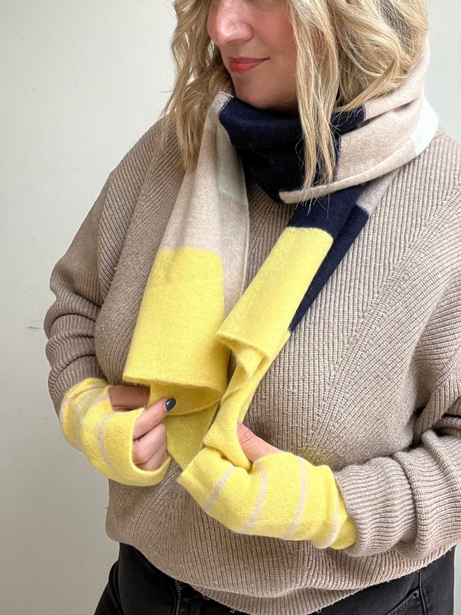 Knitted yellow navy oatmeal stripe scarf shown worn