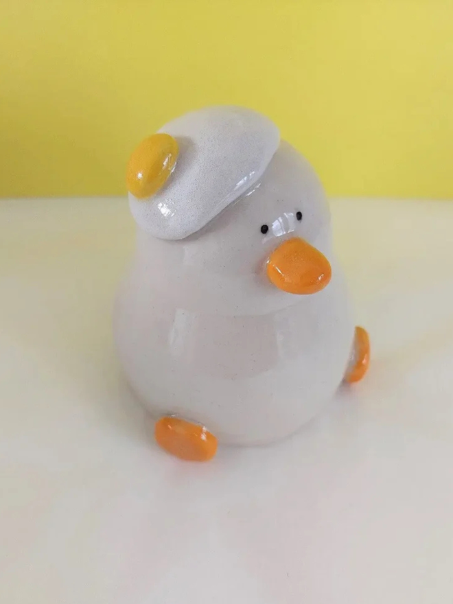 Duck egg head ceramic sculpture