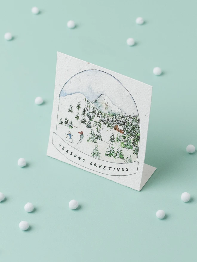 seasons greetings snow globe christmas card