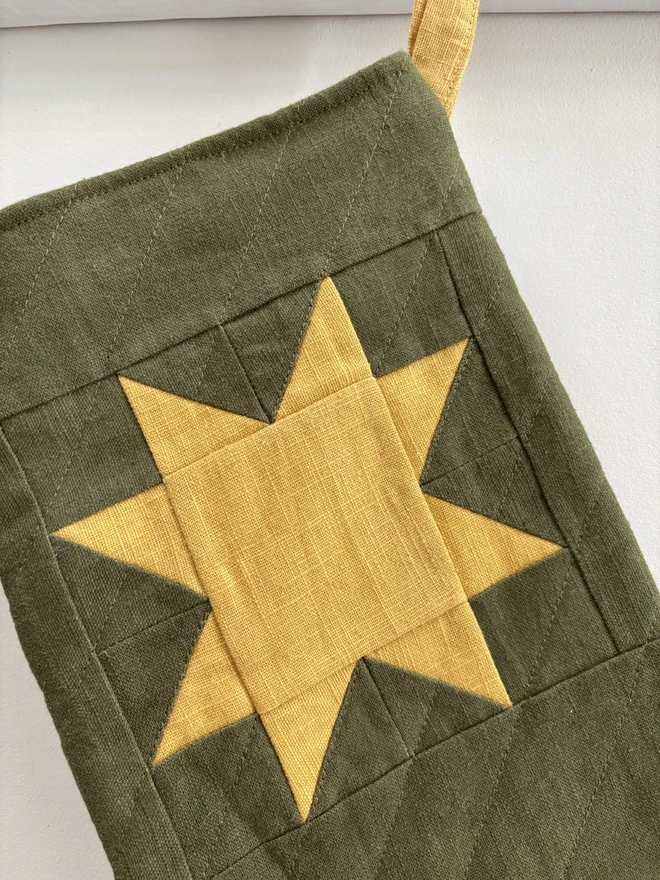 Yellow Linen Star Design on Green Linen Quilted Christmas Stocking.