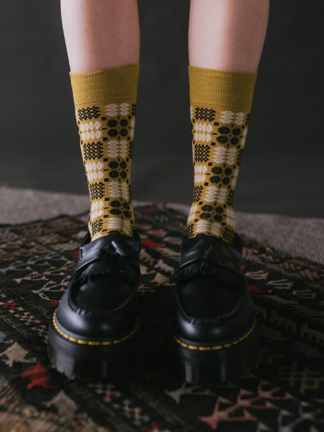 yellow brown knitted socks with doc martens