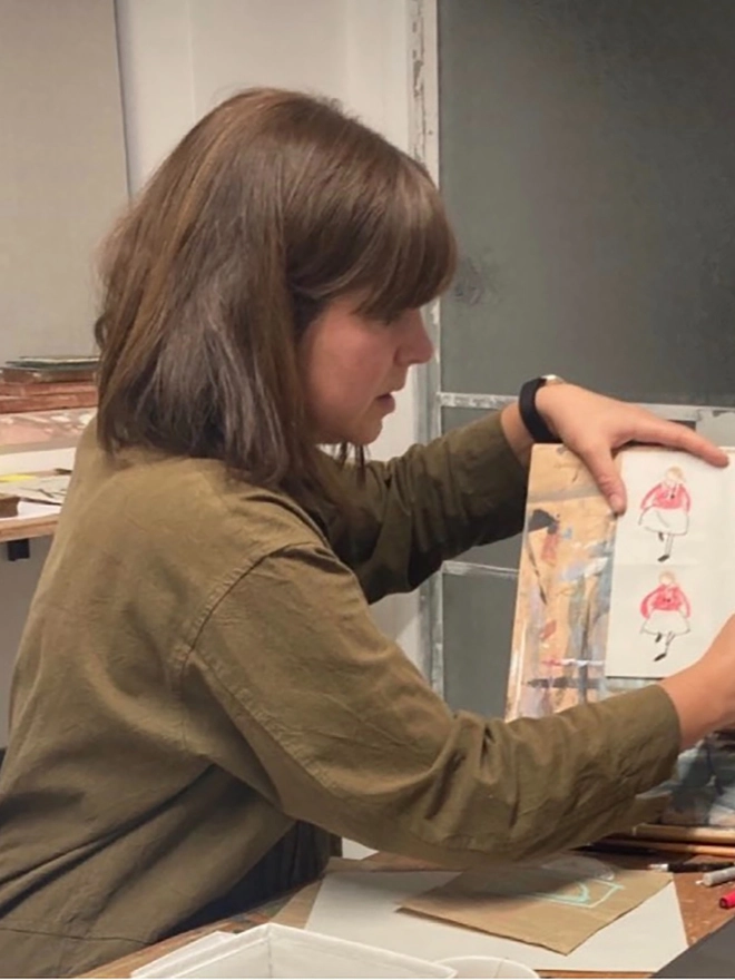 artist in studio drawing