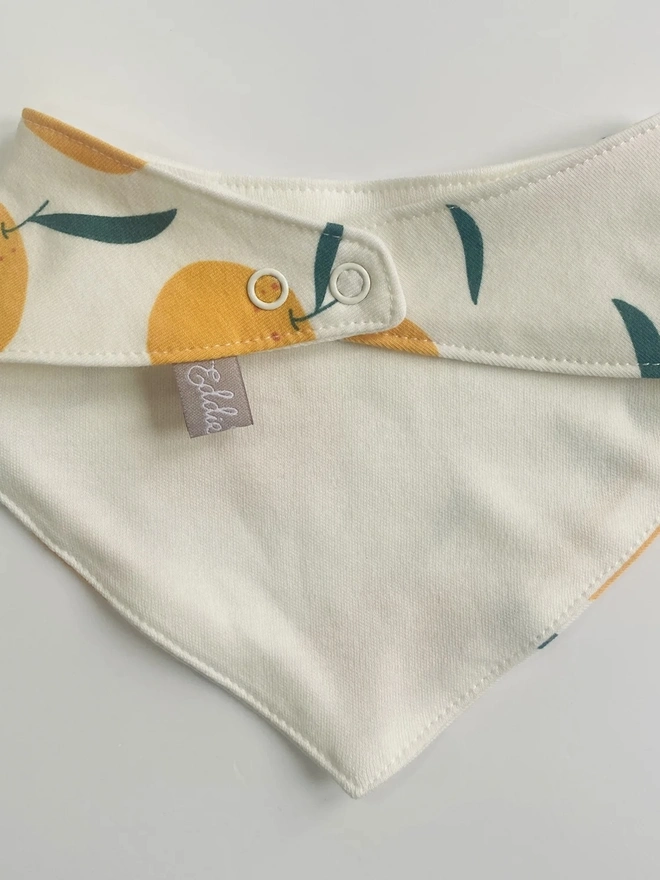 Organic Cotton Baby Dribble bib in Cream "Clementine" Print.