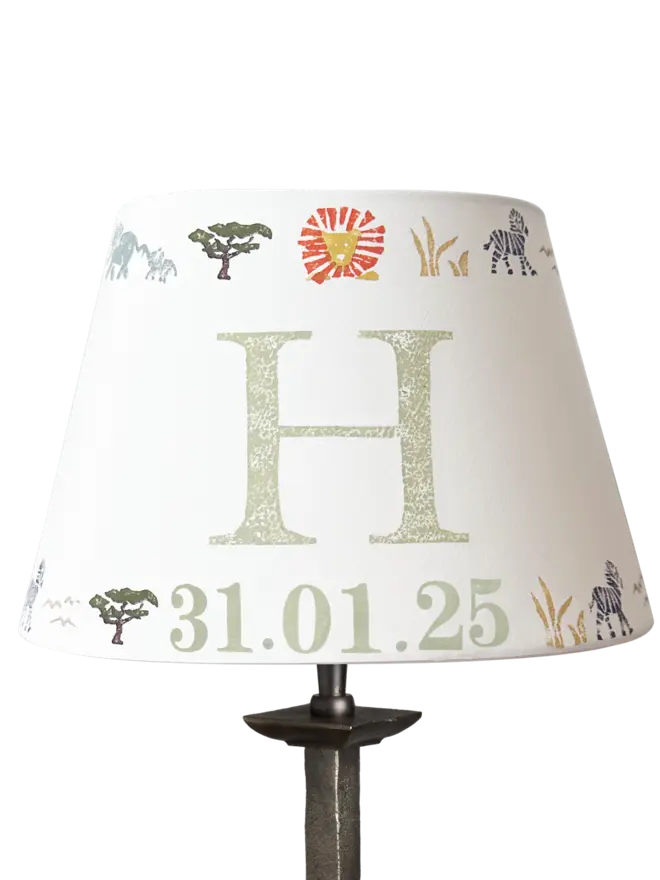 Studio Zef product image of a personalised kids safari lampshade with letter H. Empire lampshade featuring safari animals, perfect as a boys lampshade, kids lighting or presents for new parents.
