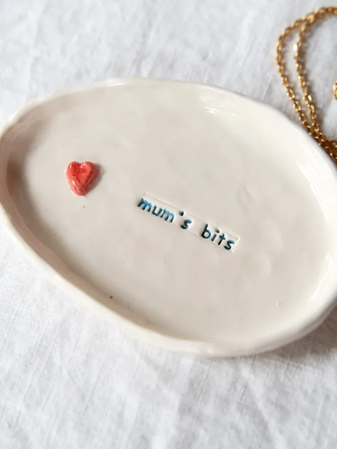 Handmade ceramic trinket dish: stamped with "mum's bits" and finished with a small red heart 