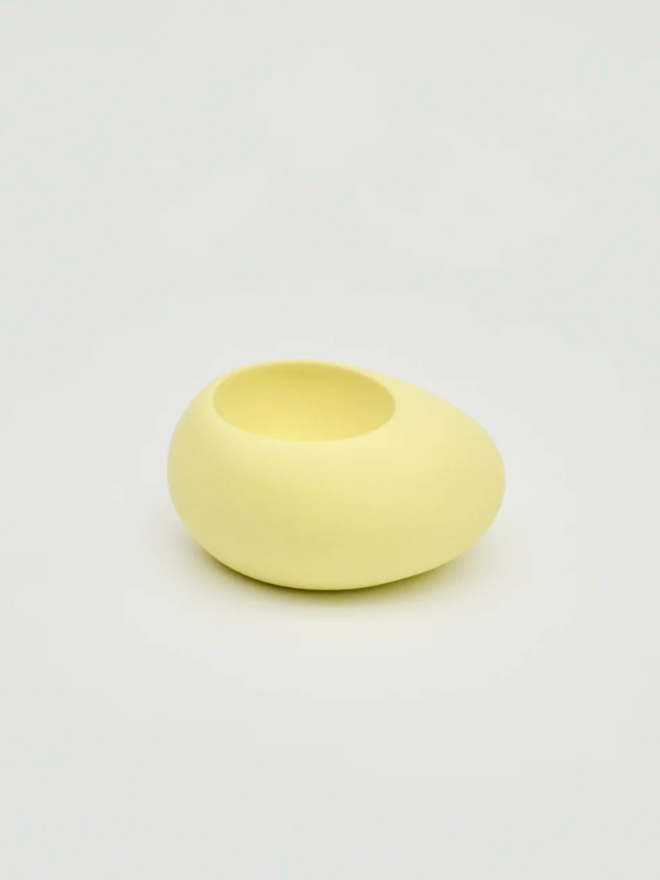 Kelly Egg Cup. A yellow egg cup.