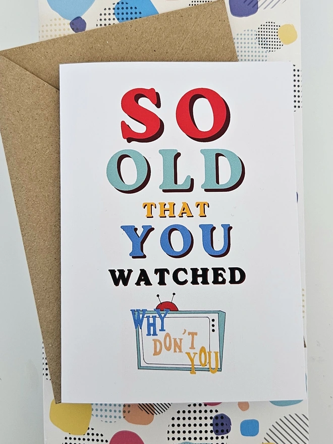 A nostalgic card that says So old that you watched Why Don't You in colourful retro style fonts on a white background with an illustration of a TV with the words Why Don't You written in a similar way to the programmes TV titles.