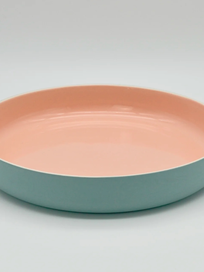 Serving Plate. A turquoise serving plate with pink interior.