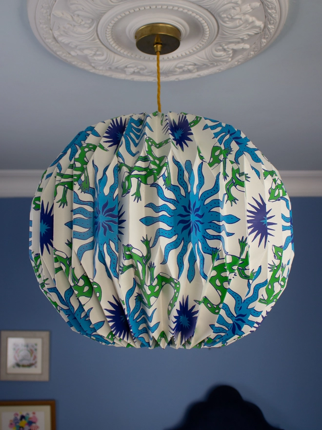 Lizard print origami lightshade hanging from ceiling 