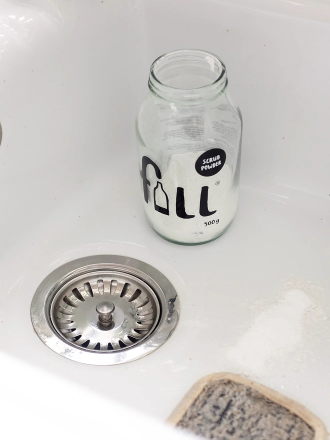 jar of scrub powder sitting in sink