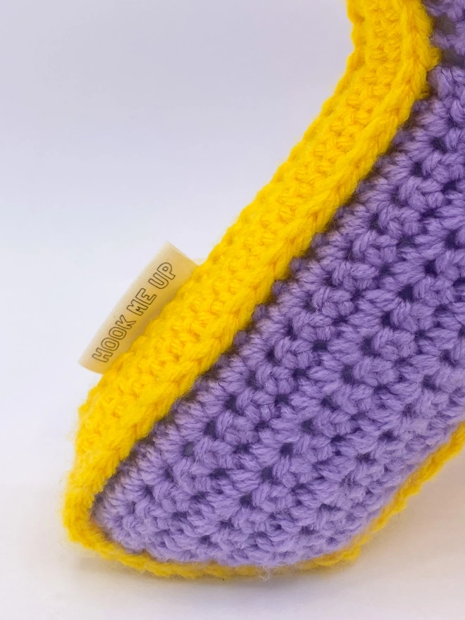 Crochet Cushion shaped like an X in Lilac and Sunshine Yellow, detail