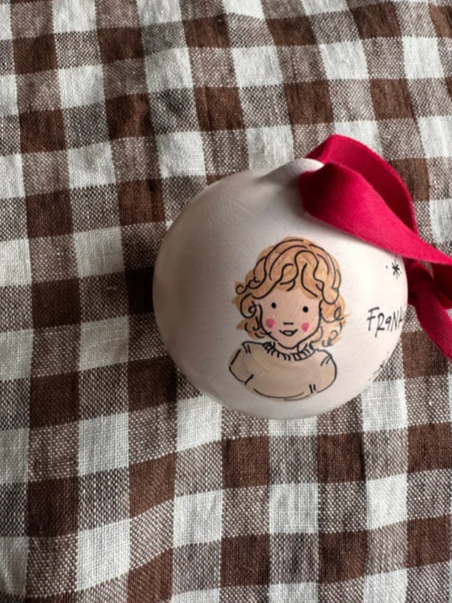 Personalised Illustrated Bauble. A bauble with a personalised illustration.
