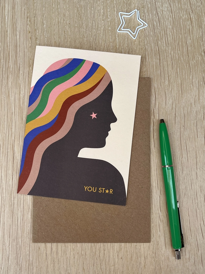Greetings card with a girl in profile and brightly coloured hair