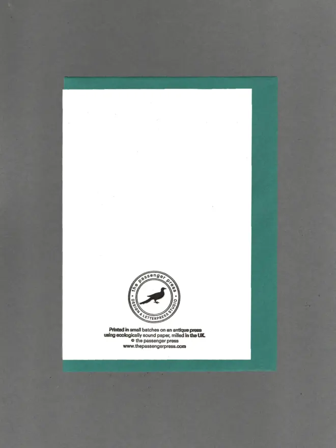 Back of card with teal envelope enfolded