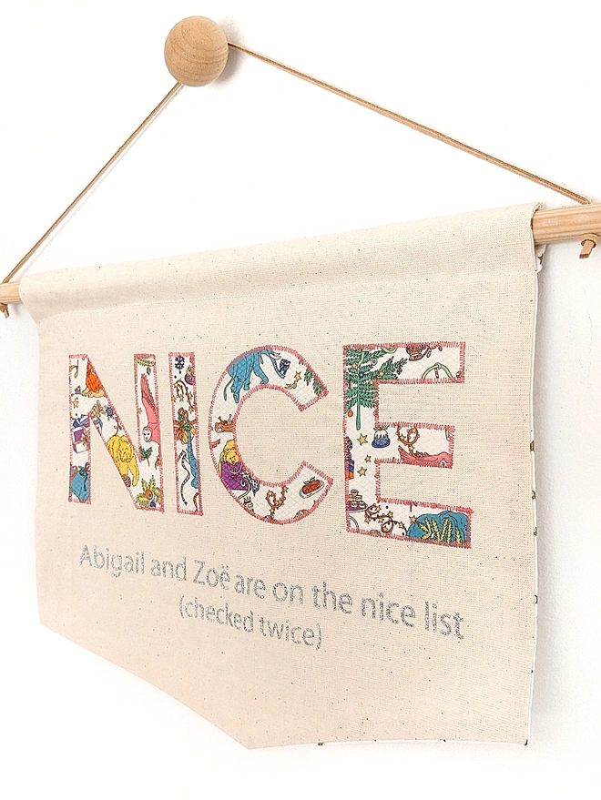 Nice appliqued on a banner in Liberty Christmas star fabric, fresh from Santa's nice list