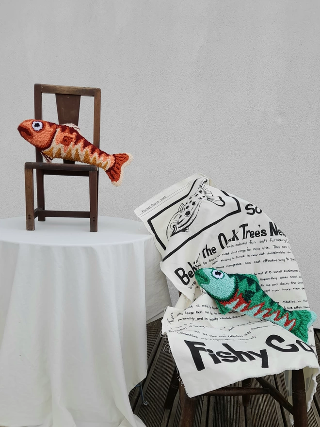 Two Handmade Needle Punched fish cushions on vintage wooden chairs
