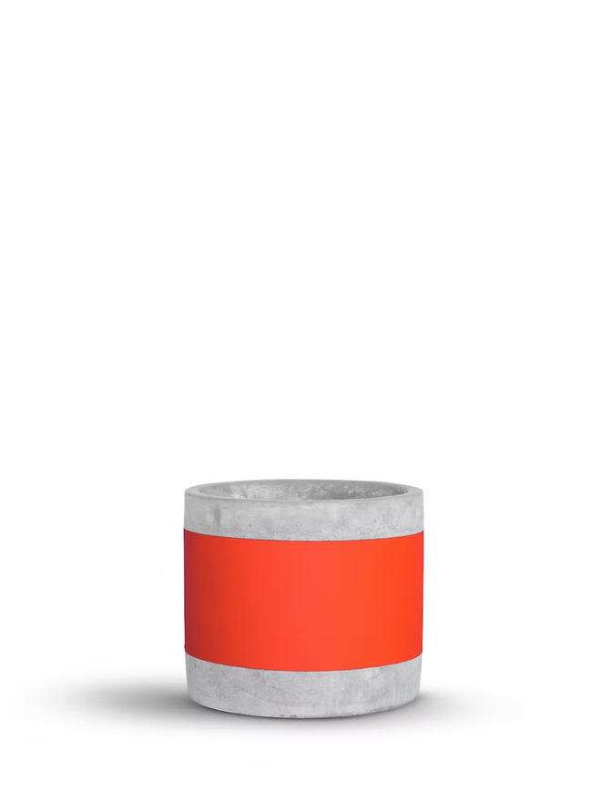 coloured middle concrete plant pot. a grey concrete plant pot with a bright red stripe around the middle.