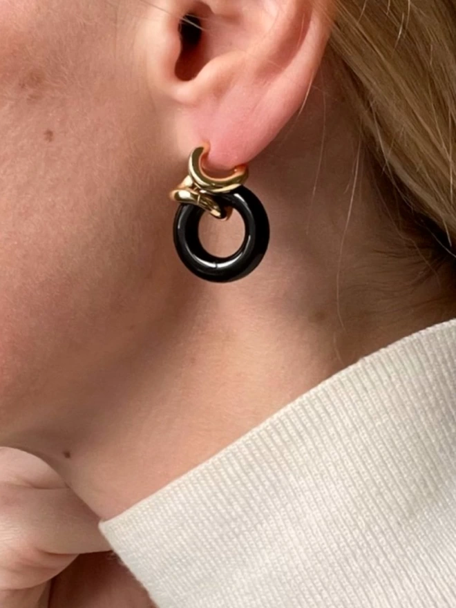 Comfortable ear hugging twisted gold and black onyx earrings