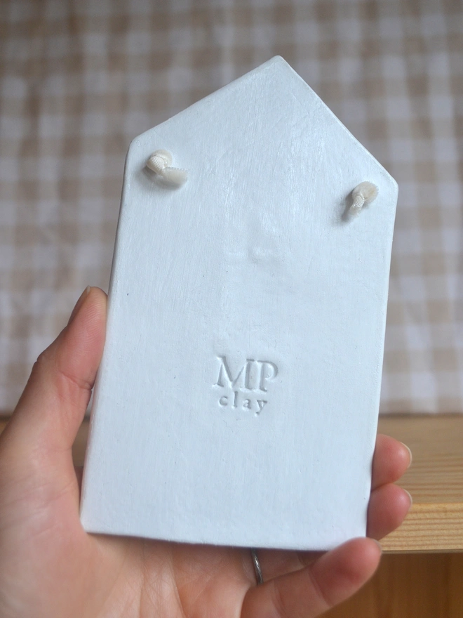 back of hanging ceramic decoration