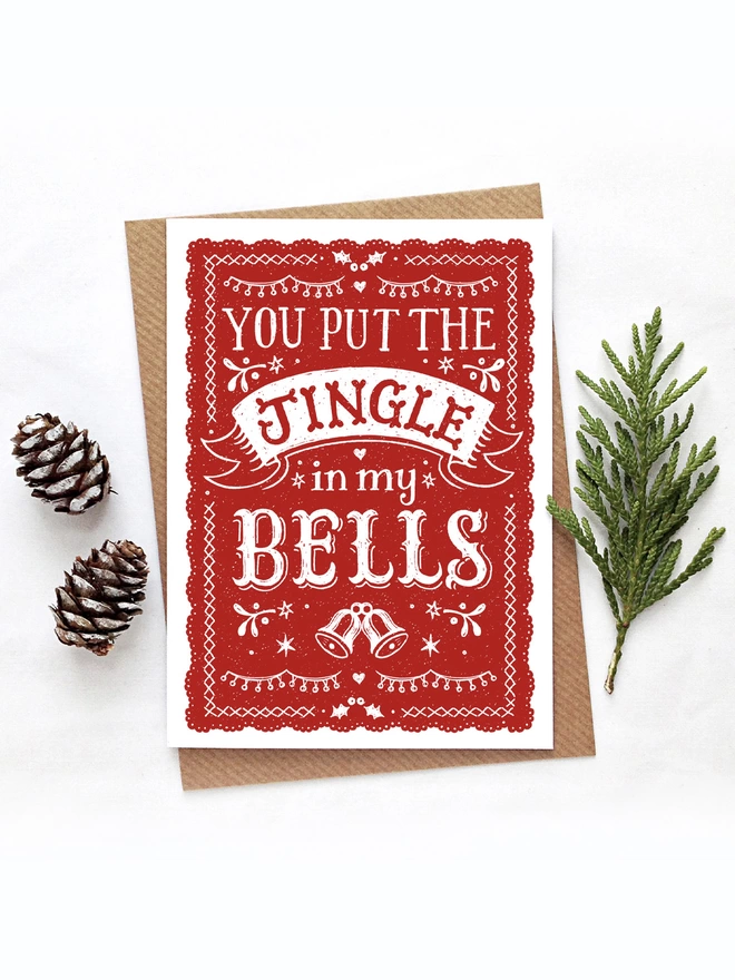 red and white you put the jingle in my bells christmas card with cones