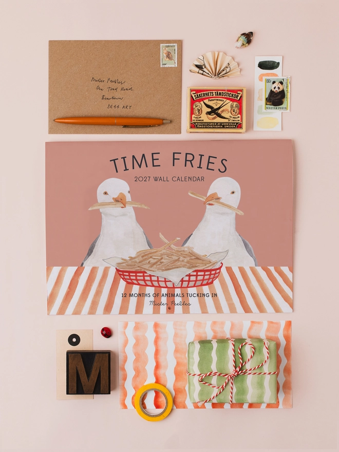2027 wall calendar with seagull illustration surrounded by stationery