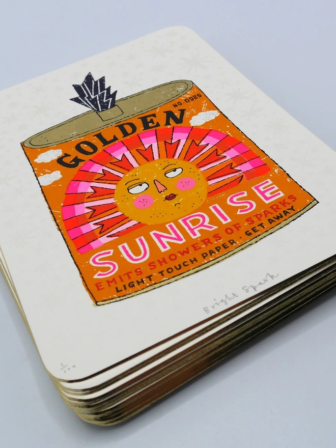 Sun And Moon Firework Screenprint Duo, a pair of colourful firework designs in the centre of white card. 