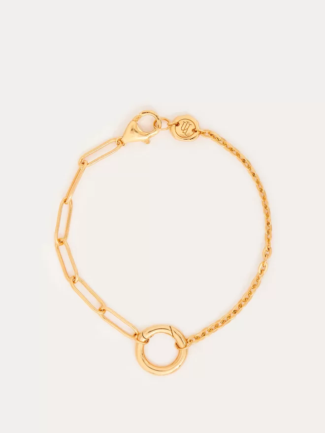 gold bracelet with paperlink chain on one side and a cable chain on the other
