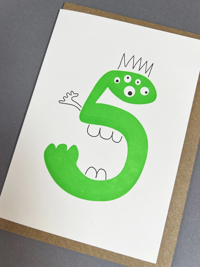 Neon green Alien number five celebration note with five eyes and five teeth