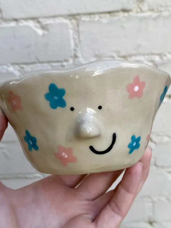 handmade ceramic smiley face floral pot