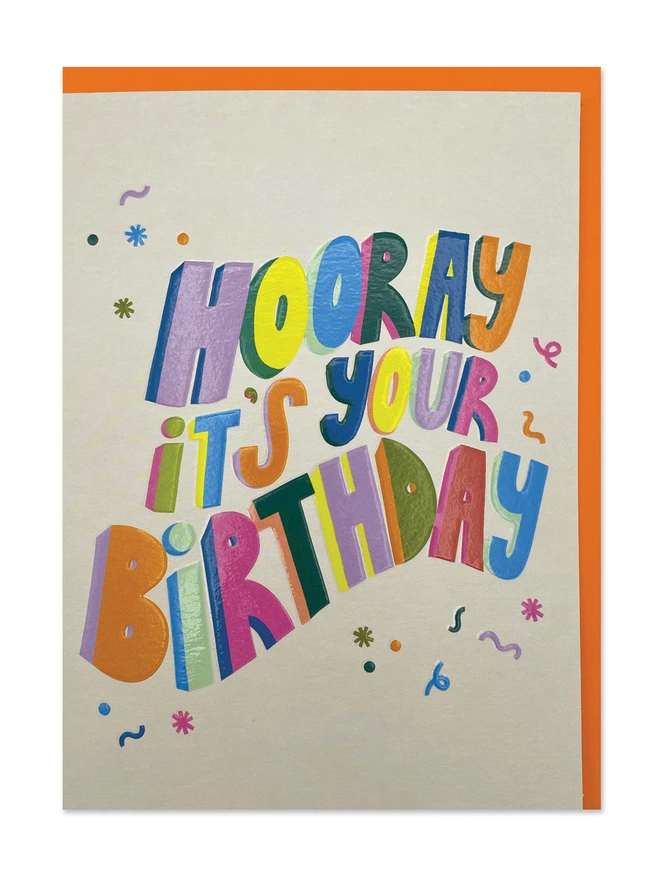 A Birthday card with colourful, playful bold type with a ‘Happy Birthday’ message on a cream background