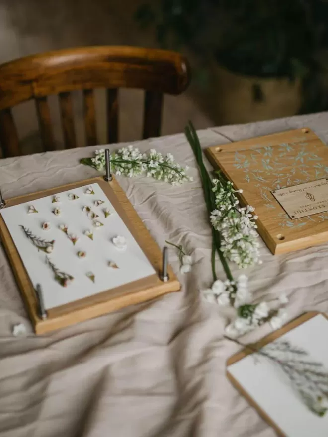 Wooden Flower Press - Medium flowers arranged on the flower press with flowers next to the press