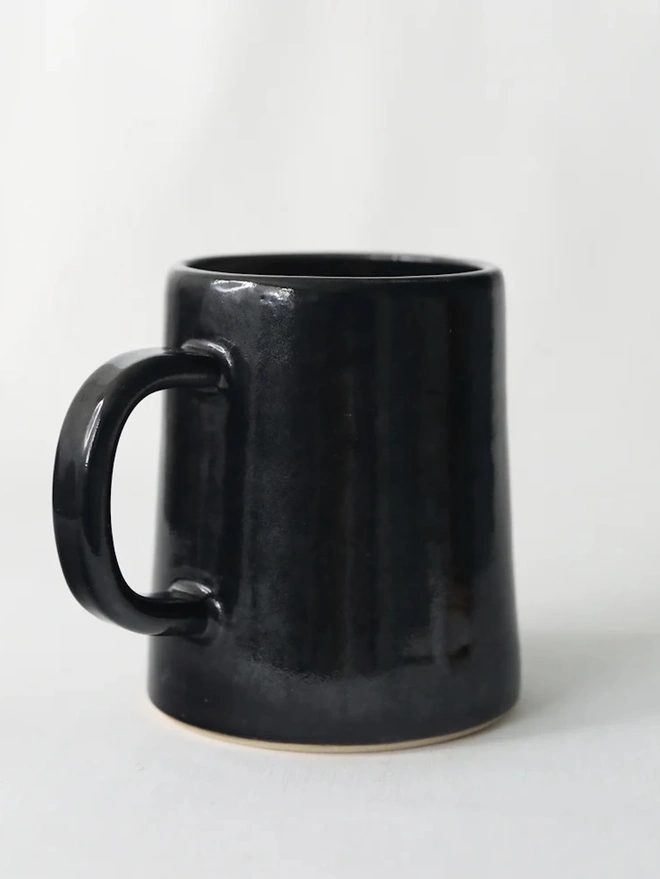 Ceramic Pint Mug, a colourful ceramic mug sitting on a white surface against a plain backdrop. 