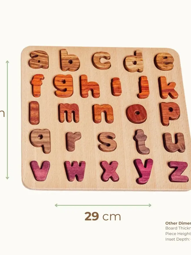 Wood Alphabet Puzzle Heirloom Toy, on a white table. 