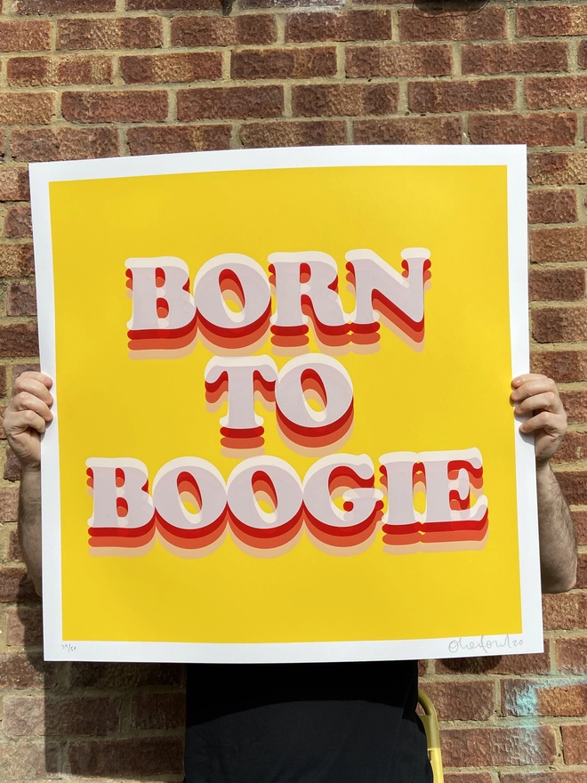 large yellow background with born to boogie typography printed on the top in large retro letters 
