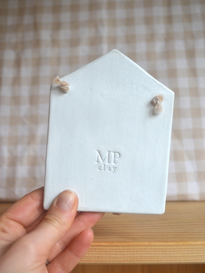 back of hanging ceramic decoration