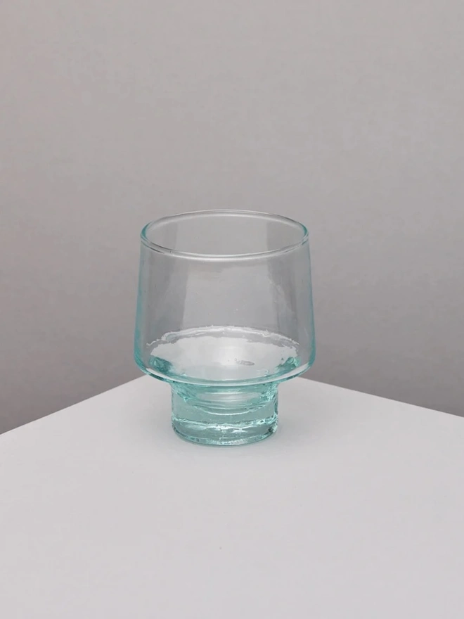 Low Wine Glasses (Set Of 1 Or 4), a wine glass sitting on a plain counter top against a white backdrop. 