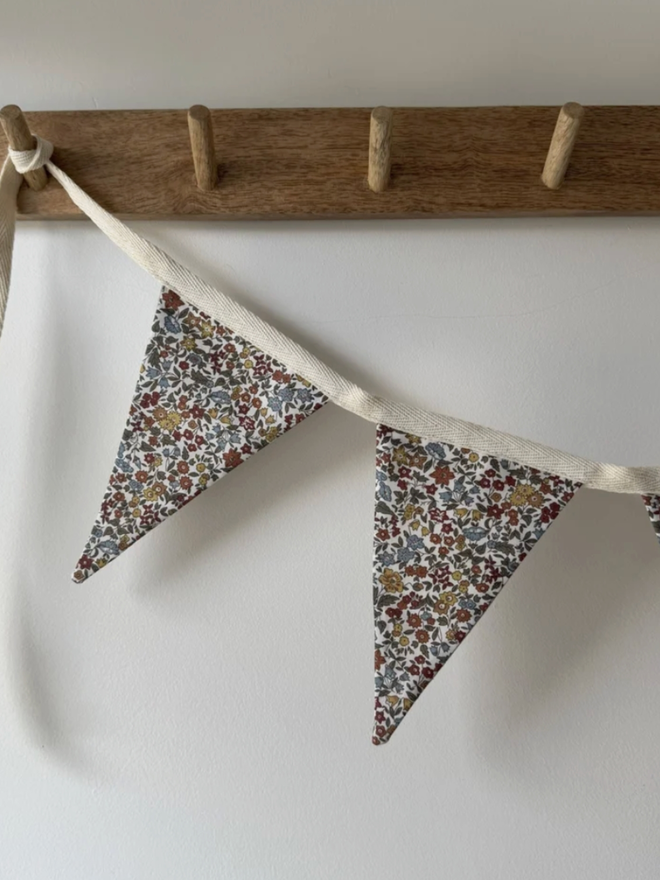 Floral Bunting. Bunting displayed on a shelf.
