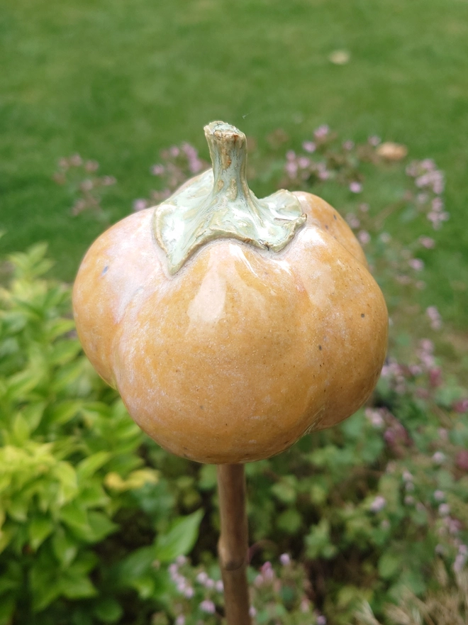 Stoneware pumpkin garden cane topper