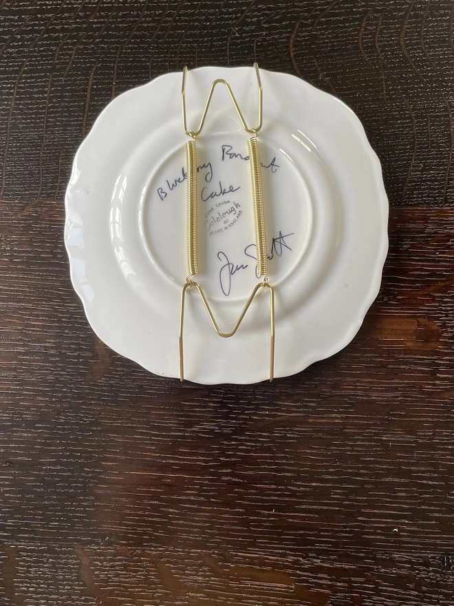 plate hanger on back of blueberry cake plate