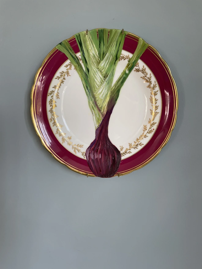red spring onion painting on plate