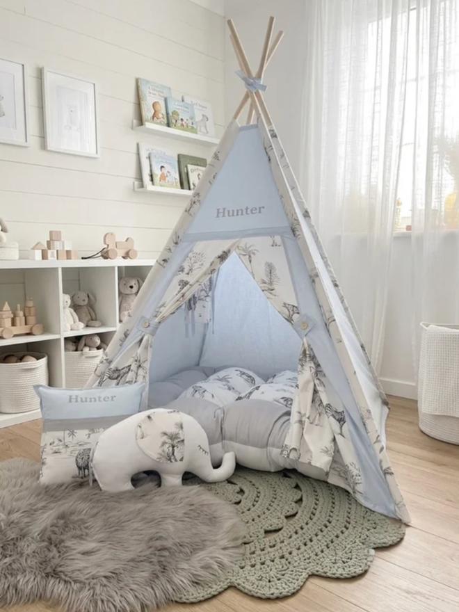 Personalised Safari Kids’ Teepee. A blue teepee with a jungle pattern.