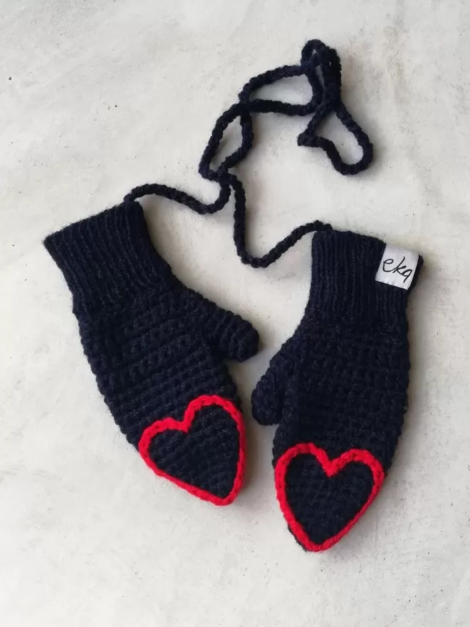 EKA Child Heart Tipped Mittens seen in black and red.