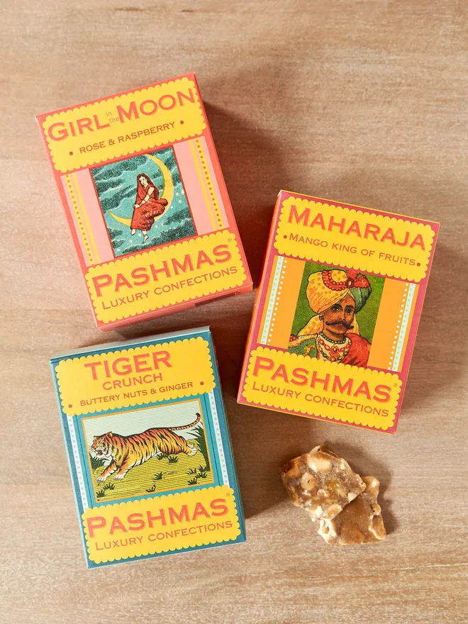 three boxes of pashamas sweets with illustrated labels