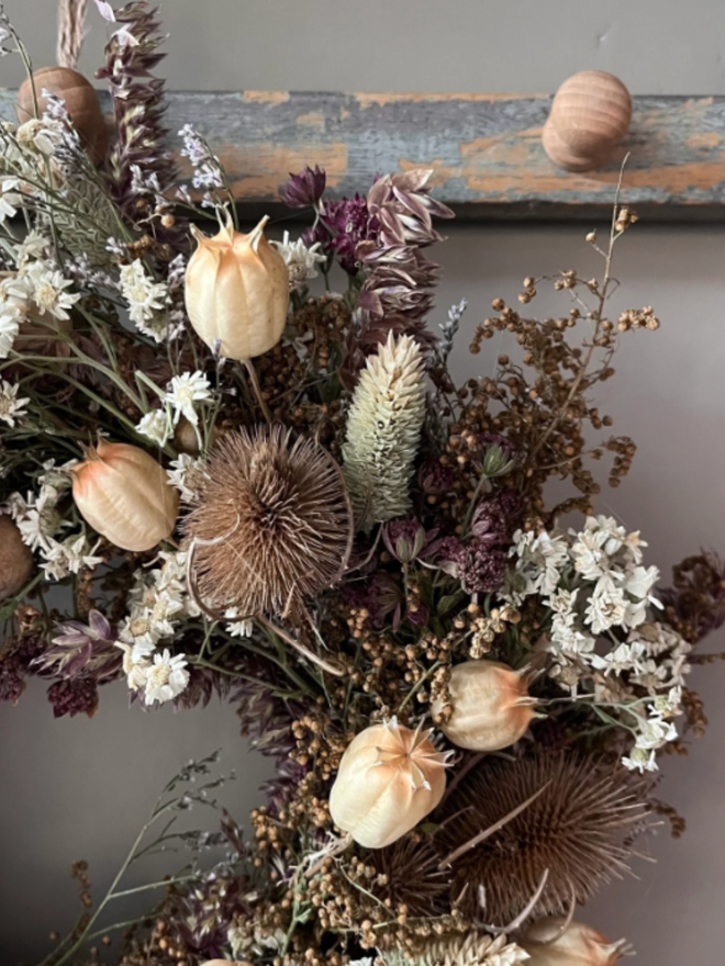 Winter Wreath. A wreath made of winter plants, hung on a wall.