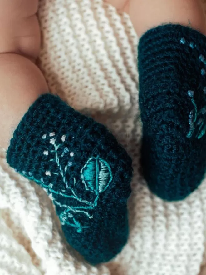 EKA crotched boots with embroidered flowers.