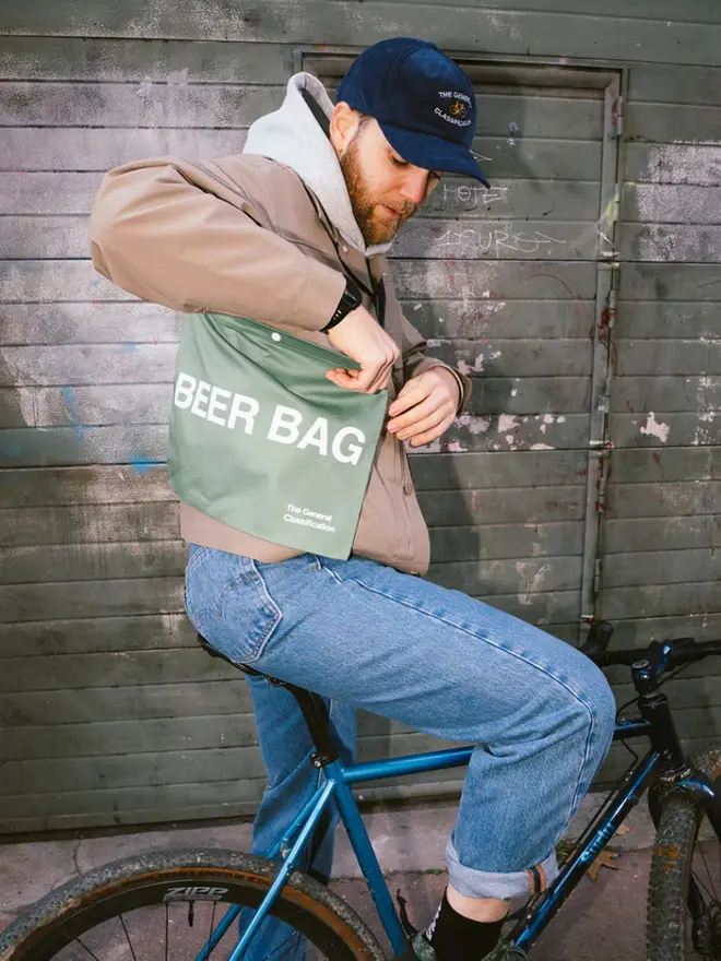 'Beer Bag' Musette Bag, against a grey background. 